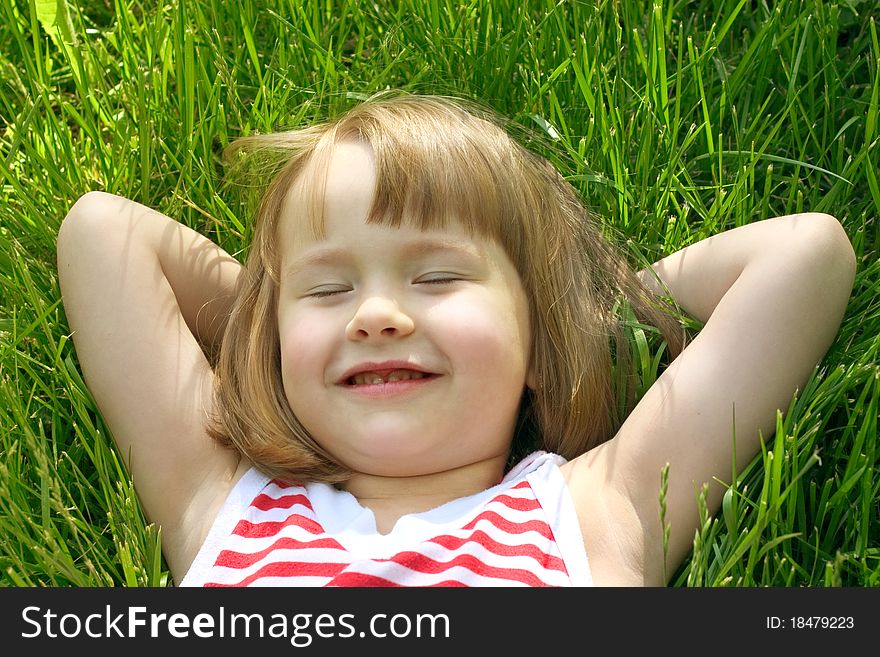 Cute little girl in grass