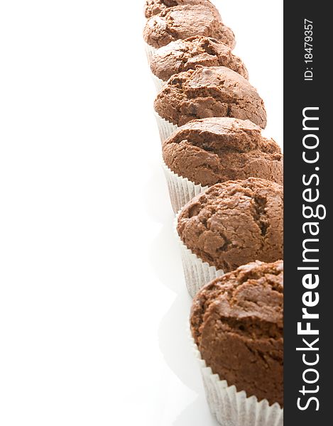 Column chocolate muffin on a white background. Column chocolate muffin on a white background