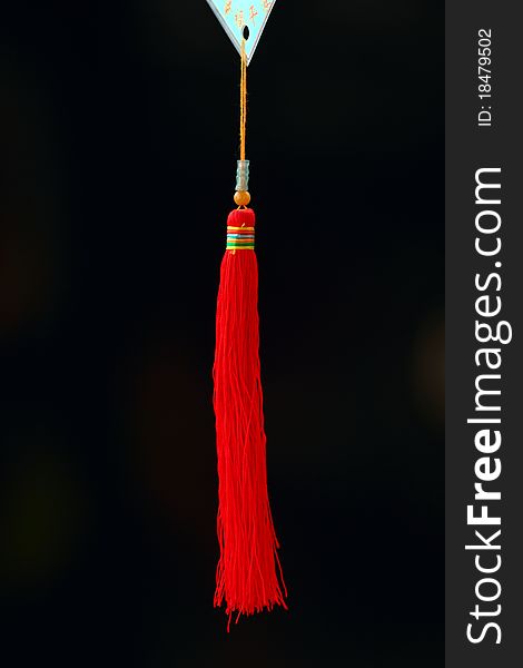 Red tassel in the blackgrounds.