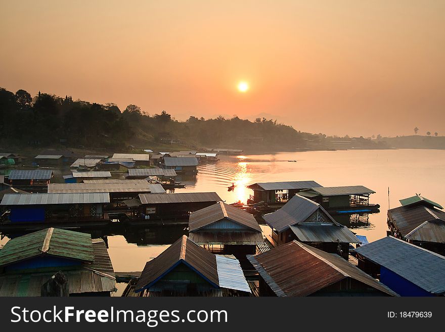 Sunset behide thai community in karnjanaburi