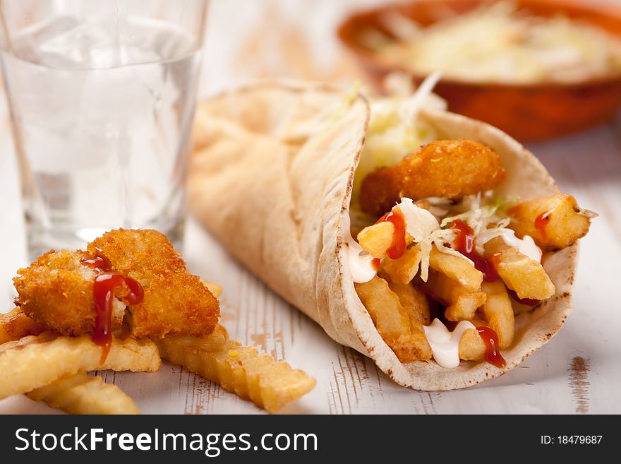 Soft flour tortilla filled with crispy potato bites and crisp shredded lettuce. Soft flour tortilla filled with crispy potato bites and crisp shredded lettuce