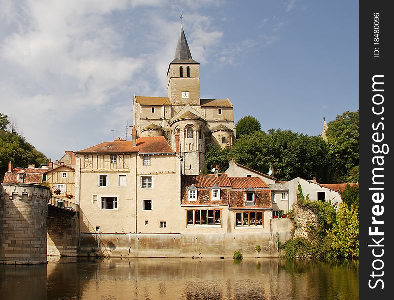 Medieval houses and Church on the banks of a river in Rural France. Medieval houses and Church on the banks of a river in Rural France