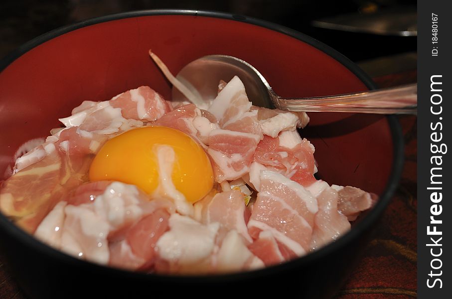 A closeup of a bowl of raw ingredients for making Okonomiyaki (Japanese cabbage pancake). A closeup of a bowl of raw ingredients for making Okonomiyaki (Japanese cabbage pancake).