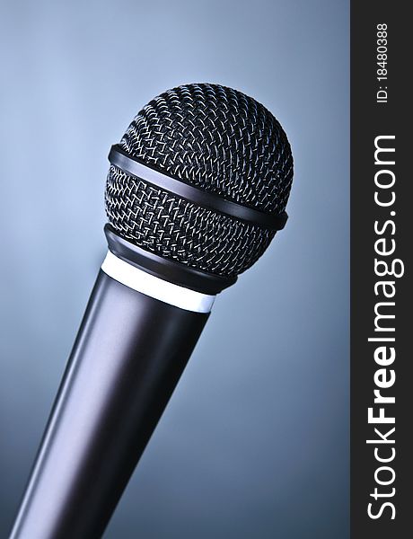 Retro microphone on the coloured background