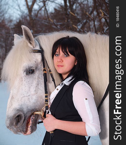 A girl and a horse for a walk in the park. A girl and a horse for a walk in the park