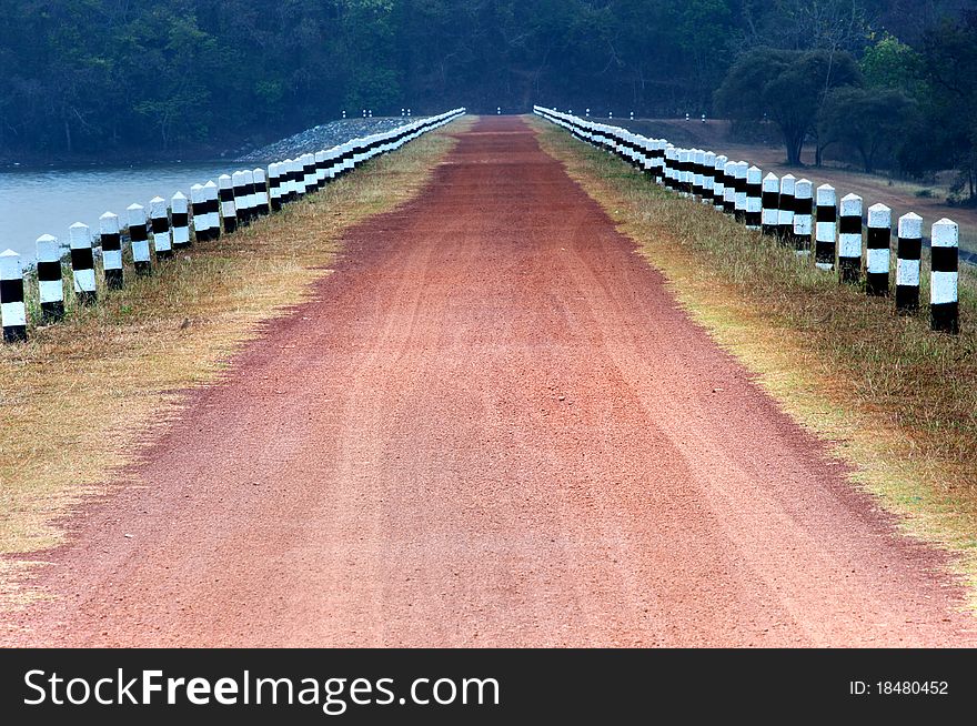 Rural road stretches through the reservoir. Rural road stretches through the reservoir.