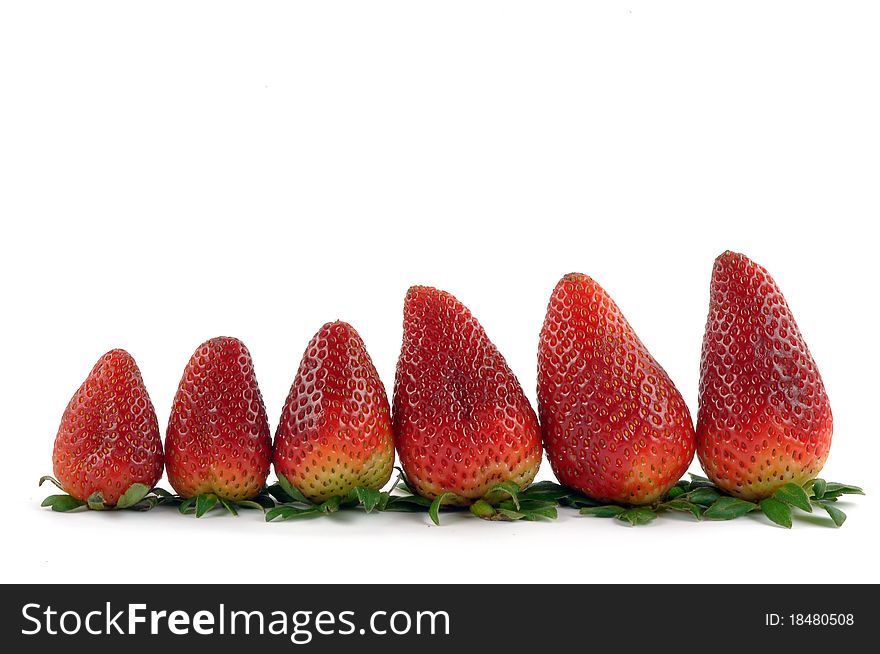 Fresh strawberries in a row on white background. Fresh strawberries in a row on white background