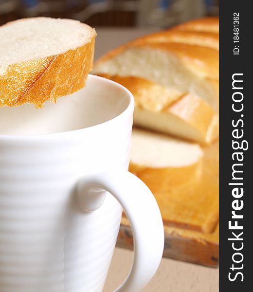 Milk in a mug and bread. Milk in a mug and bread
