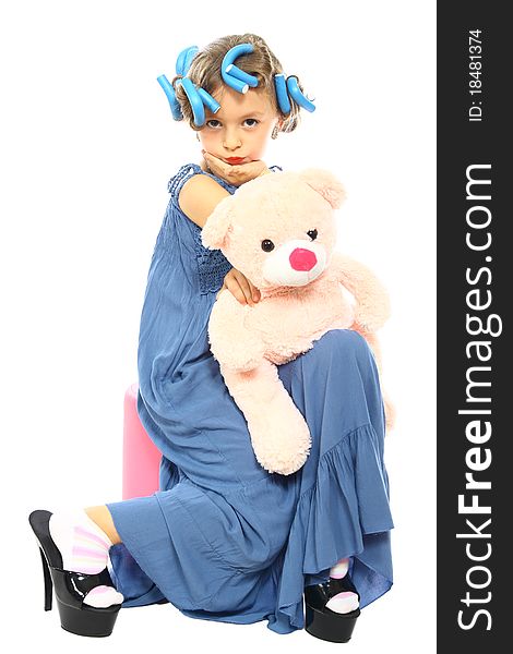 Beautiful little girl posing with his teddy bear