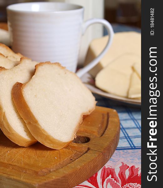 Milk in a mug and bread. Milk in a mug and bread