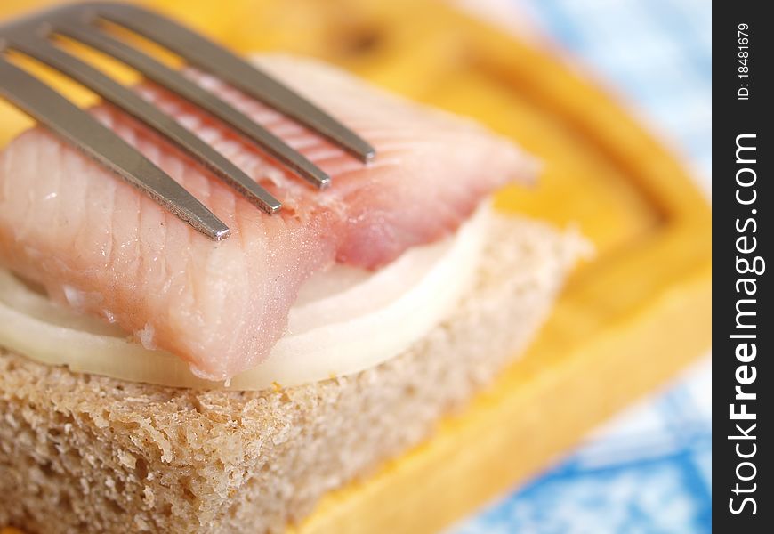 Salted fish, bread and onion closeup. Salted fish, bread and onion closeup