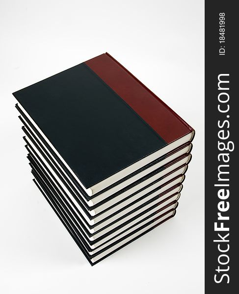 Close-up of encyclopedic volumes on white background. Close-up of encyclopedic volumes on white background