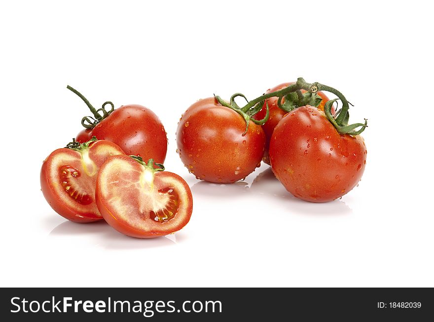 A bunch of cluster tomatoes on a white background with space for a message or product