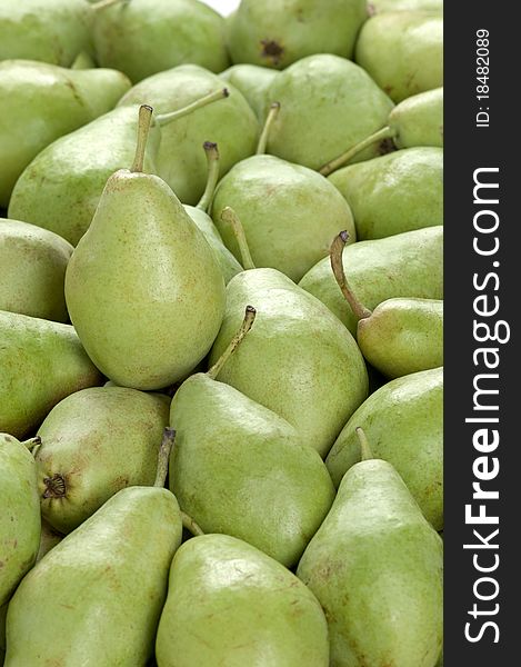 A vertical frame full of green pears