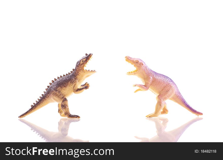 Toy Dinosaur T-Rex's Fighting Over White With Reflection