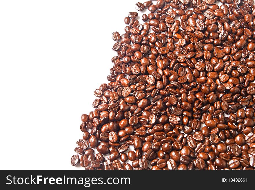Many brown coffee beans on white background. Many brown coffee beans on white background