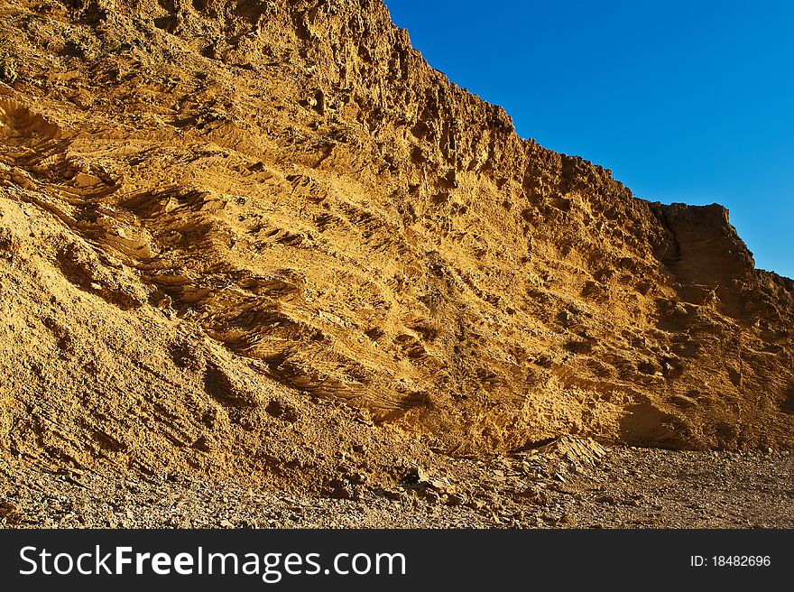 View of ancient coastal sea beach wall with original texture of limestone. Mediterranean. View of ancient coastal sea beach wall with original texture of limestone. Mediterranean.