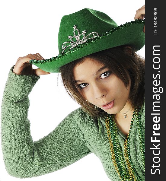 Close-up portrait of a pretty young teen preparing for St. Patrick's Day. Isolated on white.
