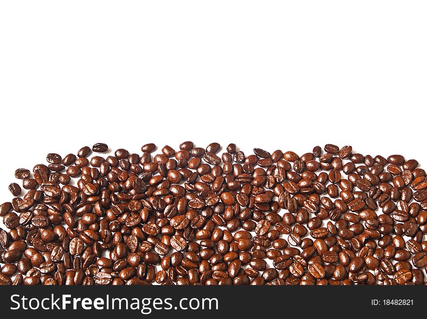 Many brown coffee beans on white background. Many brown coffee beans on white background