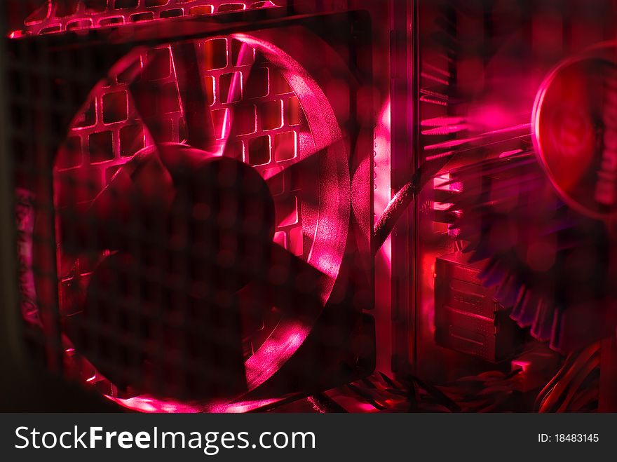 Inside of a desktop computer in the red light. Inside of a desktop computer in the red light