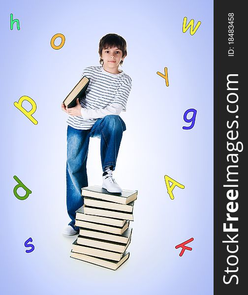 Cute little boy near the stack of big books on white background