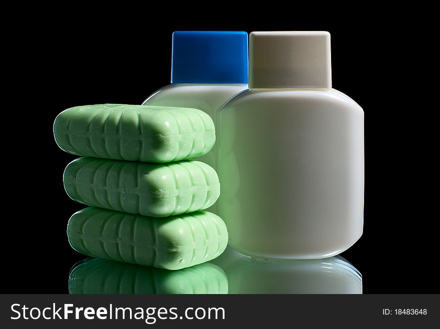 Soap pieces with two cosmetic bottles. Soap pieces with two cosmetic bottles.
