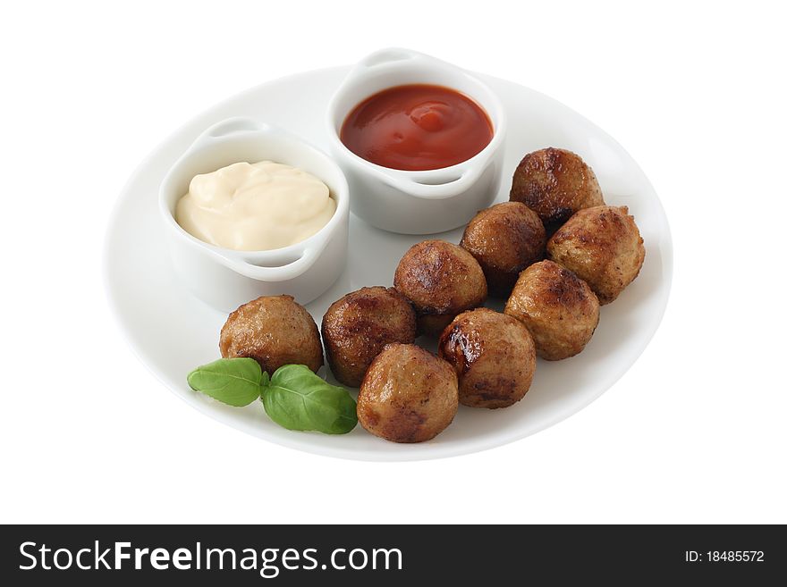 Chicken meatballs with sauces and basil