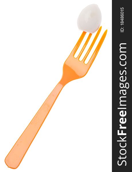 Hard Boiled Quail Egg on Fork Isolated on White with a Clipping Path.