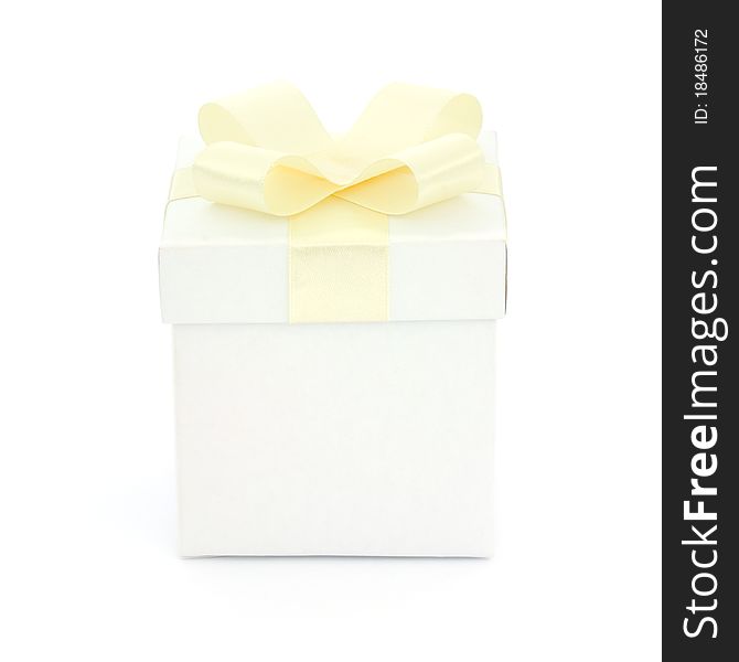 White gift box with a yellow bow on white background. White gift box with a yellow bow on white background