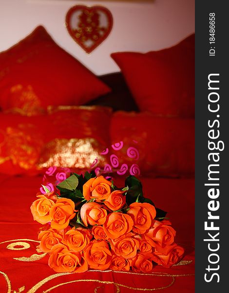 This is the typical Chinese wedding bed, a bridal Bouquet on a red bed.