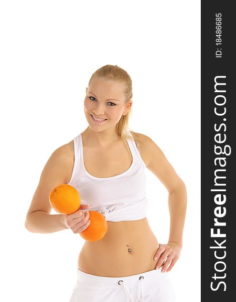 Woman engaged in fitness dumbbells of oranges