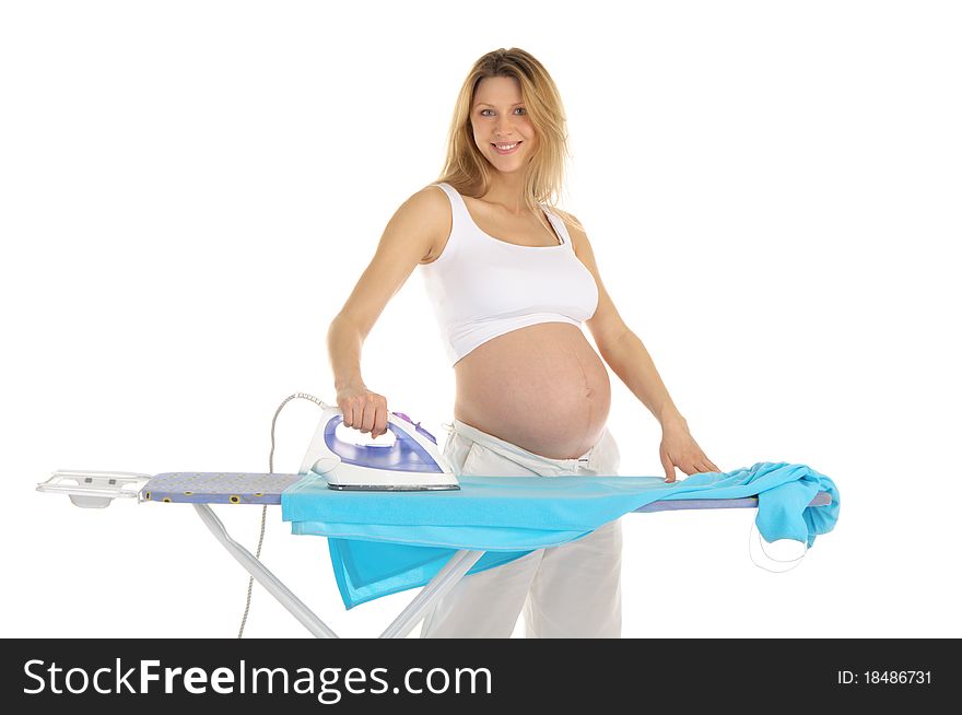Pregnant woman in a white suit with an iron isolated on white
