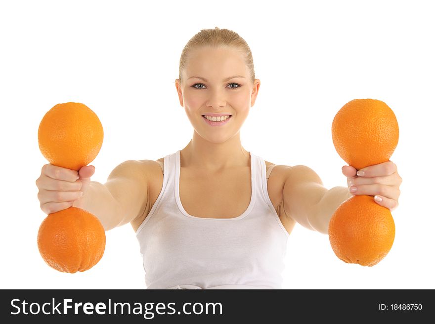 Woman engaged in fitness dumbbells of oranges isolated on white