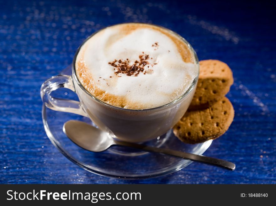 Cappuccino On Blue Glass Table
