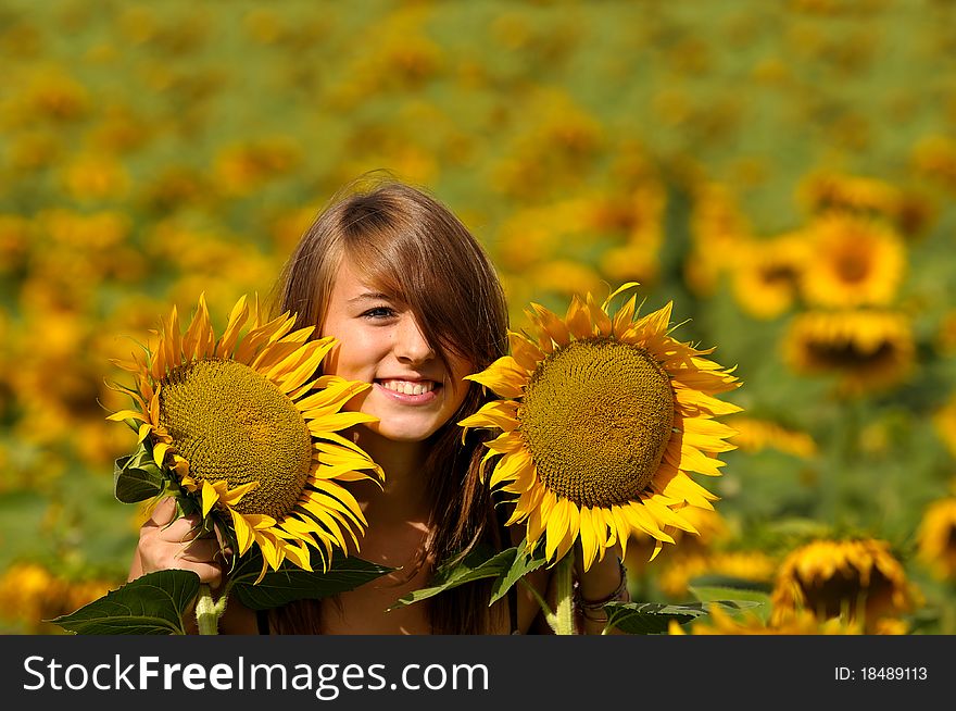 A young woman blossomed into sunflower. A young woman blossomed into sunflower