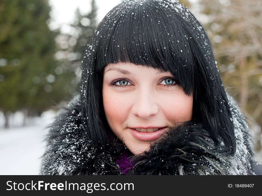 Girl in snowflake look at camera smiling. Girl in snowflake look at camera smiling