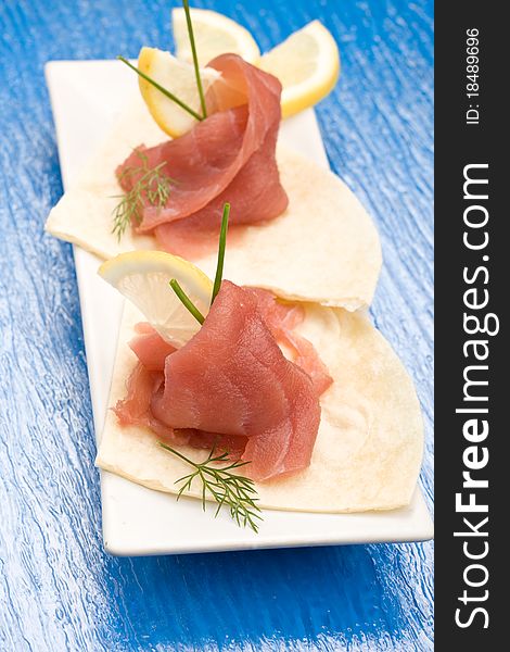 Photo of delicious tuna sleces on flat bread with lemon and fennel. Photo of delicious tuna sleces on flat bread with lemon and fennel