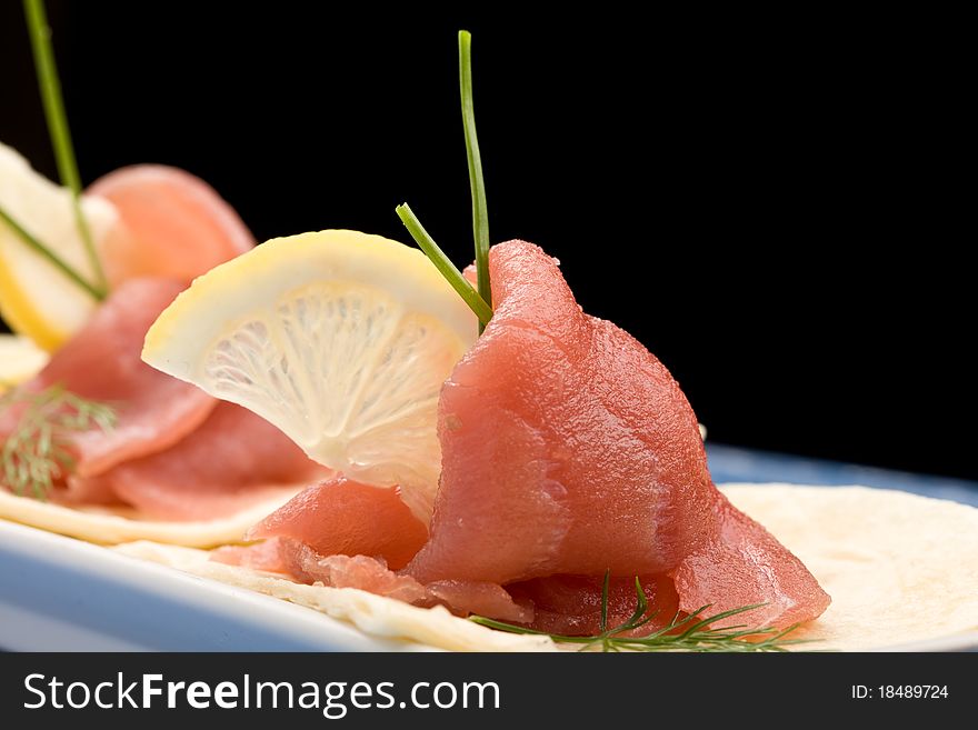 Photo of delicious tuna sleces on flat bread with lemon and fennel. Photo of delicious tuna sleces on flat bread with lemon and fennel