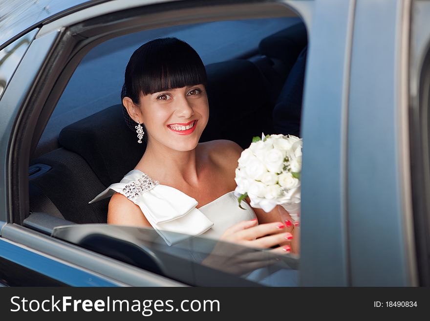 Portrait Of The Bride In The Wedding Car