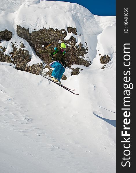 Freerider jumping from the steep. Caucasus mountains