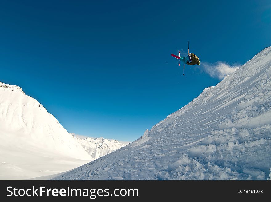 Skier flying in the air. Caucasus mountains