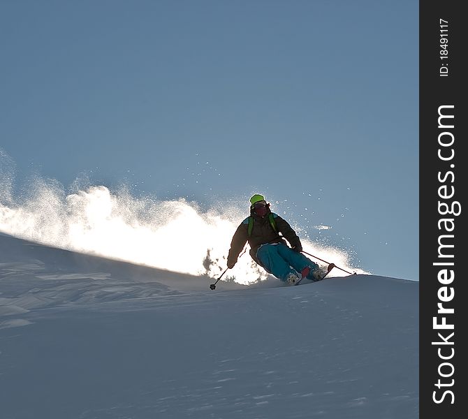 Freerider in the aura of snow powder. Freerider in the aura of snow powder