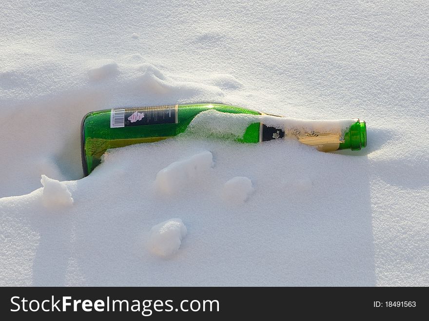 Bottles of sparkling wine in the snow. Bottles of sparkling wine in the snow.