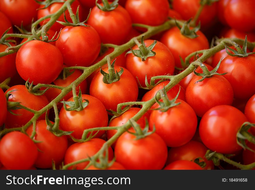 Red tomatoes closeup at a market place. Red tomatoes closeup at a market place