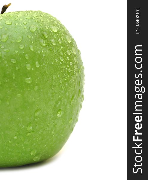 Wet green apple closeup