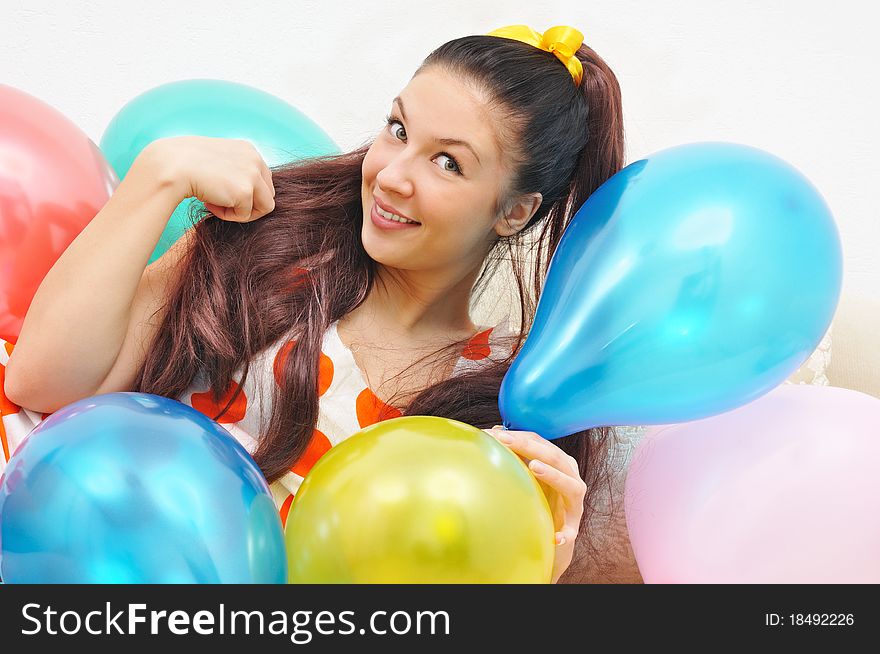 Girl smile a happy smile with balloons. over white