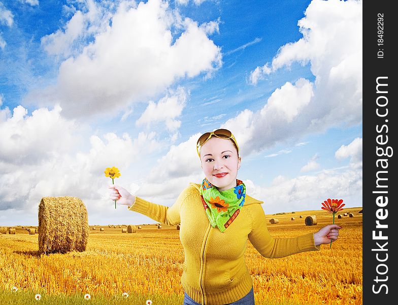 girl and autumn landscape: grain field and cloudy blue sky. girl and autumn landscape: grain field and cloudy blue sky