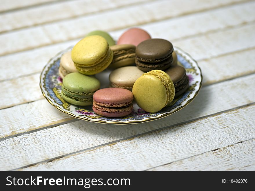 Macaroons; a plate of beautifully-coloured macaroons; very loose composition to allow for cropping of copy-space. Macaroons; a plate of beautifully-coloured macaroons; very loose composition to allow for cropping of copy-space