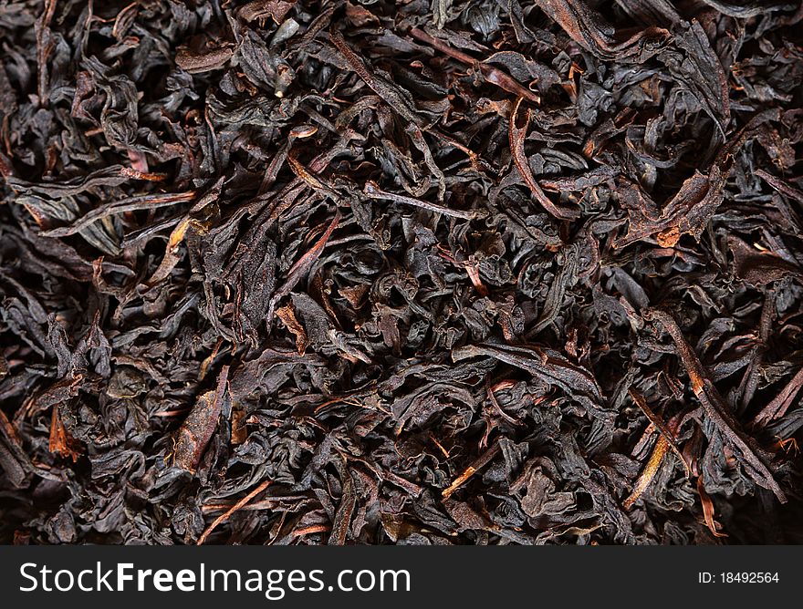 Scattering black tea. Macro. Color image.