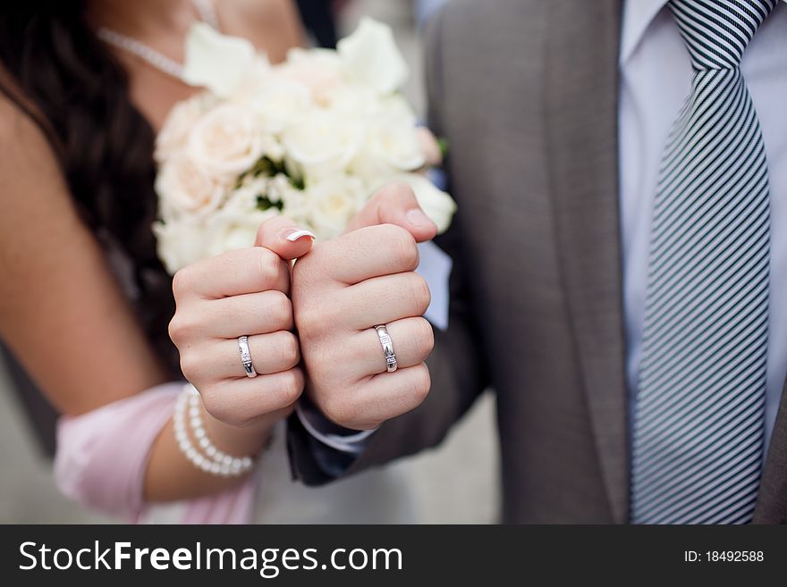 Fists of bride and groom. Fists of bride and groom